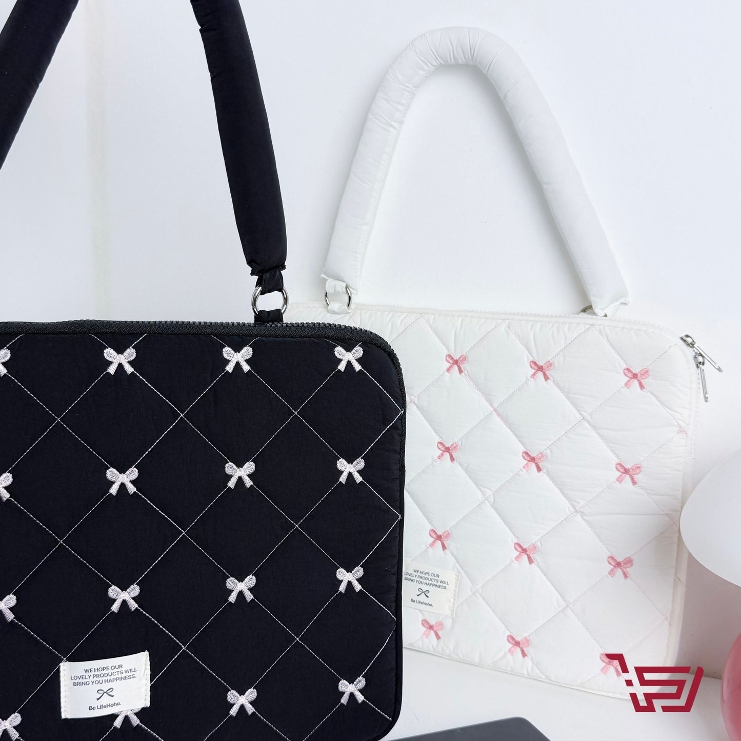 حقيبة ايباد وحاسبة مبطنة بطبعات الفيونكة