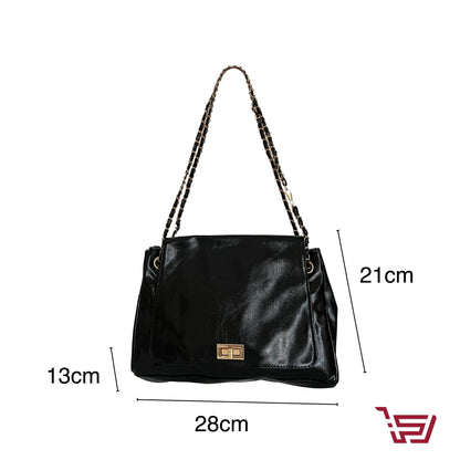 حقيبة يد جلد متوسطة الحجم