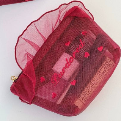 حقيبة مكياج القلوب شفافة حمراء