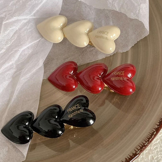 قراصة شعر شكل قلب